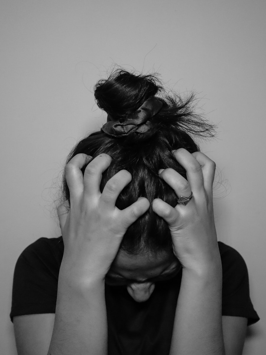Photo by Simran Sood a woman covering her face with her hands